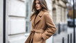 © Elnare - Beautiful young woman wearing a stylish camel coat.
