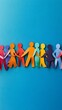 © rehan - Colorful Paper People Holding Hands on Blue Background