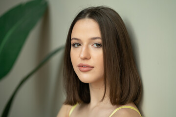 portrait of young beautiful woman with short hair in studio