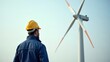 © pondolar - Renewable Energy Engineer Supervising Wind Turbine Construction Project