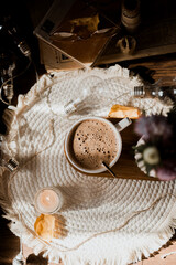 mocha coffee in white cup with foam, golden spoon, morning coffee in sunlight, autumn leaves, pink asters, autumn flowers, breakfast, candles