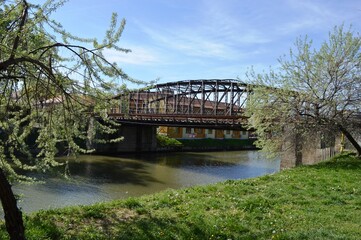 a large metal bridge over the river