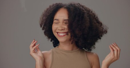 Canvas Print - Face, afro haircare and woman with playful, natural and confidence on grey studio background. Shaking, happy model and satisfaction for cosmetic, salon grooming and spa treatment for beauty glow