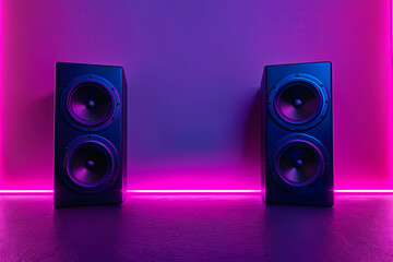 A pair of speakers sitting next to each other on a purple and pink background