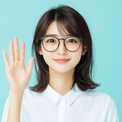 Smiling Young Woman with Short Hair Against Blue Background say hello with hand and glasses