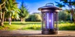 © Jane Studio - Outdoor bug zapper emitting light to attract and eliminate insects