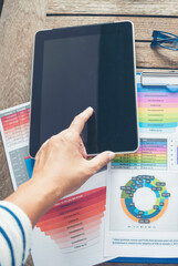 Wall Mural - Vertical Businesswoman reading financial graph charts business info with computer laptop. Vertical horizon Women hands using laptop on office desk. Close up hands of business woman working office