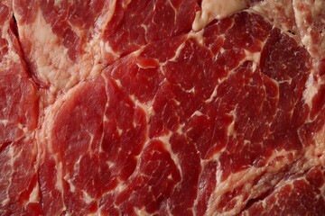 Detailed and closeup fresh raw red marbled beef texture showcases rich colors and unique textures