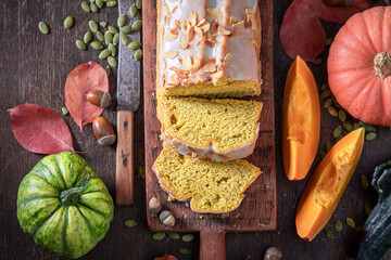 Wall Mural - Fresh pumpkin pound cake with white glaze and almonds.