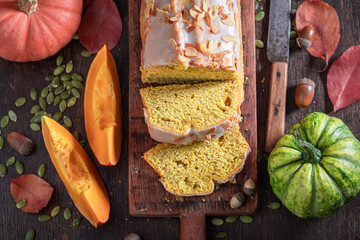 Sticker - Delicious pumpkin pound cake surrounded with acorns and leaves.