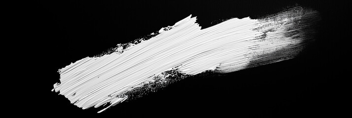 bright white brush stroke of paint on black background