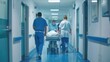 © COK House - Three hospital staff, including an Asian female and a male professional in blue scrubs, transport a patient on a gurney swiftly down a hospital corridor.