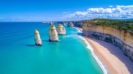 Walk along the Great Ocean Road in Australia, one of the most scenic coastal drives, passing rugged cliffs and sandy beaches. 