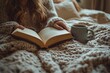 © Lubos Chlubny - Woman reading a book and holding a mug while relaxing in bed
