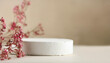 © hardvicore - Empty round podium for product presentation, minimal pedestal. Dried pink flowers. Light beige
