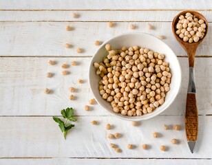 Canvas Print - A bowl of chickpeas on a white wooden surface, suggesting preparation for a healthy meal.