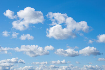 Blue sky. Beautiful sky with clouds. Summer skies in sunny weather. Background for advertising with blocks. Backdrop with blue sky for website design. Skies texture. Nature, environment