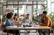 © Marharyta Tsapenko - Colleagues collaborating in a modern office