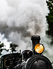 Details of a black steam train.