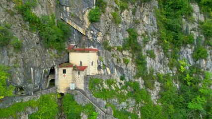 Wall Mural - San Giovanni d'Antro. Village and castle church perched on the mountain's vertical wall. Ancient settlement.