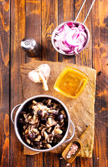 Canvas Print - pickled mushrooms in metal bowl on the table, next to spices. pickle mushrooms