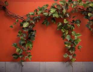 Wall Mural - Vines cascade over a vibrant orange wall, creating a lush, natural backdrop.