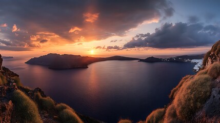 Wall Mural - A stunning sunset over a Greek island with dramatic clouds and a golden sky.