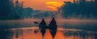 © Іван Ніколов - A couple canoeing on a tranquil lake, sharing a peaceful moment of togetherness.