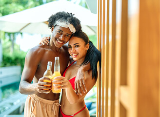 woman couple summer man drink fun vacation friendship love embracing romance togetherness romantic dating affectionate beach cocktail party bikini  joy