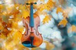 © Hafiz - Double exposure of a violin merging with autumn leaves, with copy space
