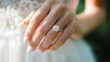 © Anthichada - Close up hand of woman with wedding ring on finger, Elegant engagement diamond ring on woman finger Love and wedding concept