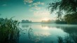 © Koplexs-Stock - Tranquil Foggy Lake at Sunrise with Reflections and Lush Greenery
