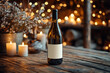 © Wanida - A bottle of wine is sitting on a wooden table with candles in the background