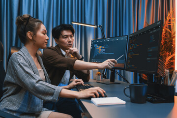 Wall Mural - it developers discussing with point to intelligent website development coder system running data onl