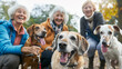 © elenarostunova - Three elderly ladies in autumn attire, smiling and posing together with their purebred Labrador dogs. Dog walk.