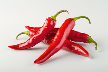 Sticker - A collection of bright red hot peppers arranged on a clean white surface, perfect for use in still life photography or as a prop in cooking and food-related images