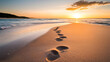 © Prasanth - footprints are lead along the sand along the beach at sunrise,