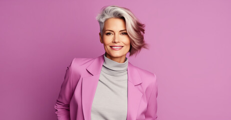 Wall Mural - Fashion portrait of beautiful stylish happy smiling mature woman with gray hair in pink clothes