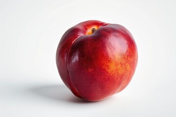 Wall Mural - A single red apple sits on a white surface