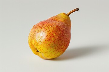 Canvas Print - A yellow pear with red spots sits on a white surface