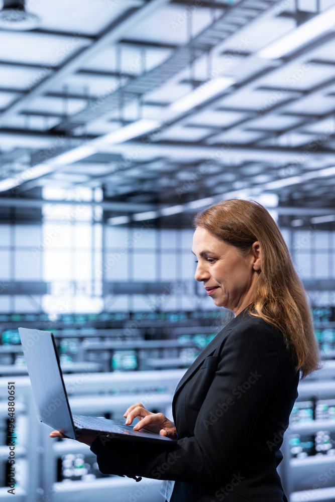 Data center system administrator ensuring safety and security of ...