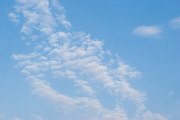 gentle white clouds in the blue sky