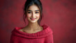 © Siasart Stock - A smiling young woman in a cozy red sweater against a soft, red background.