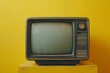© InfiniteStudio - Vintage television set with retro design, yellow background, nostalgic concept