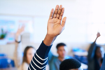 Wall Mural - Students, raised hand and classroom at college for question, learning and development with scholarship. People, education and together with sign for feedback, ideas and discussion at university