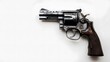 © florynstudio3 - A close-up of a silver revolver with a wooden handle on a white background.