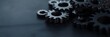 © Armin - A close-up view of gears resting on a dark surface, symbolizing mechanical precision and industrial efficiency.