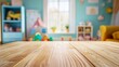 © MheeP - Lively empty wooden tabletop with generous copy space set against a blurred backdrop of a children's room, ideal for displaying products or toys.