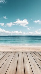 Wall Mural - Wooden Deck Overlooking a Sandy Beach and Ocean with Blue Sky and Clouds