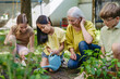 © Halfpoint - Young kids taking care of plants in school garden during at outdoor sustainable education class, planting flowers, herbs and vegetables. Concept of experiential learning and ecoliteracy.